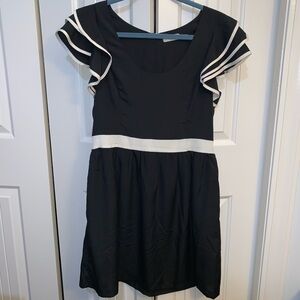 NWOT lined black and cream dress with ruffle sleeves